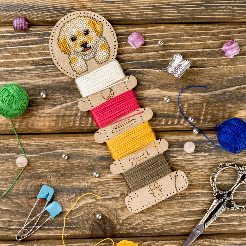 Wooden embroidery blank FLHW-013 with perforated design, thread, needle, and instructions for crafting.