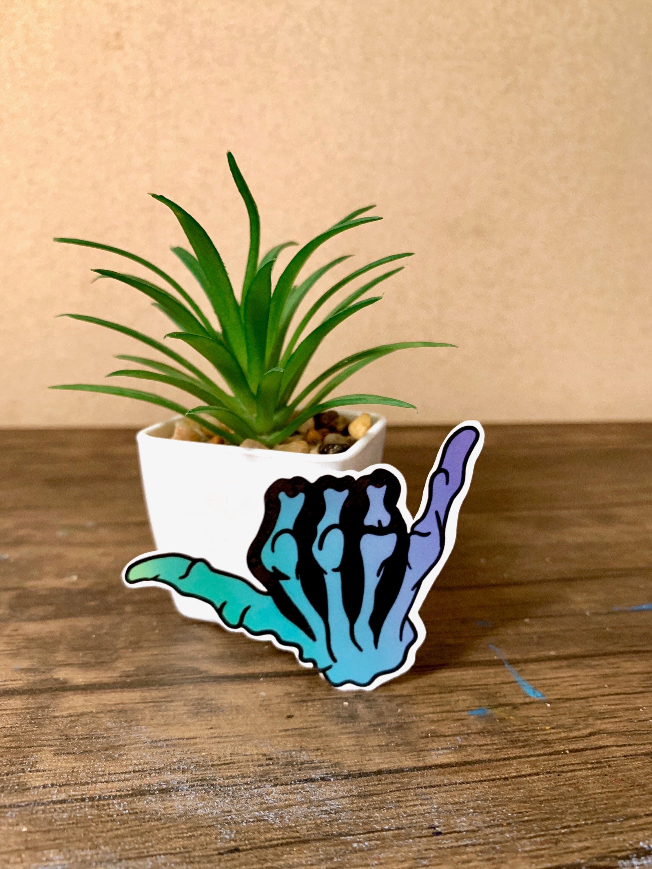 Blue gradient hang loose sticker with a shaka symbol, perfect for personalizing items like hydroflasks and laptops.