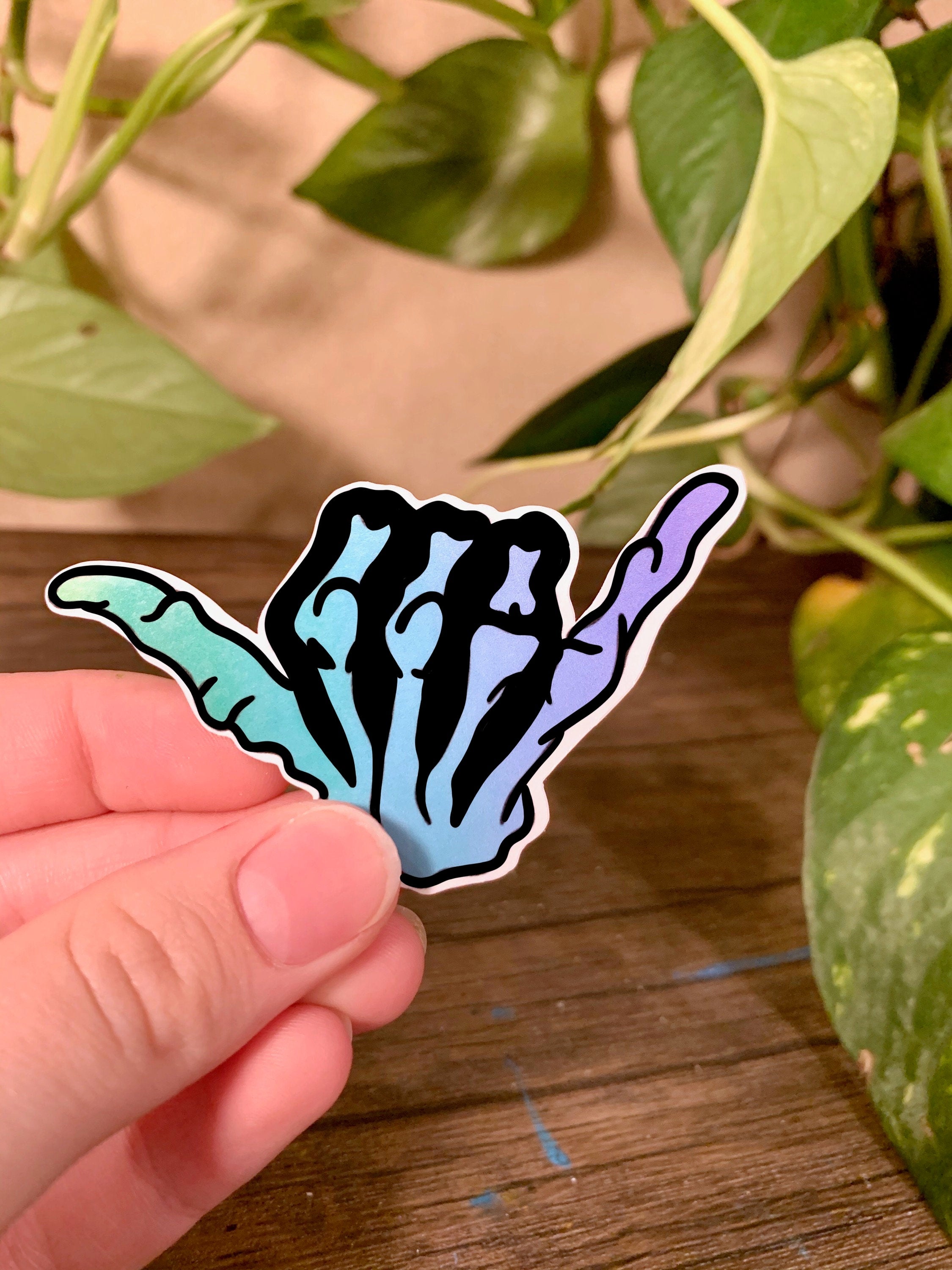Blue gradient hang loose sticker with a shaka symbol, perfect for personalizing items like hydroflasks and laptops.