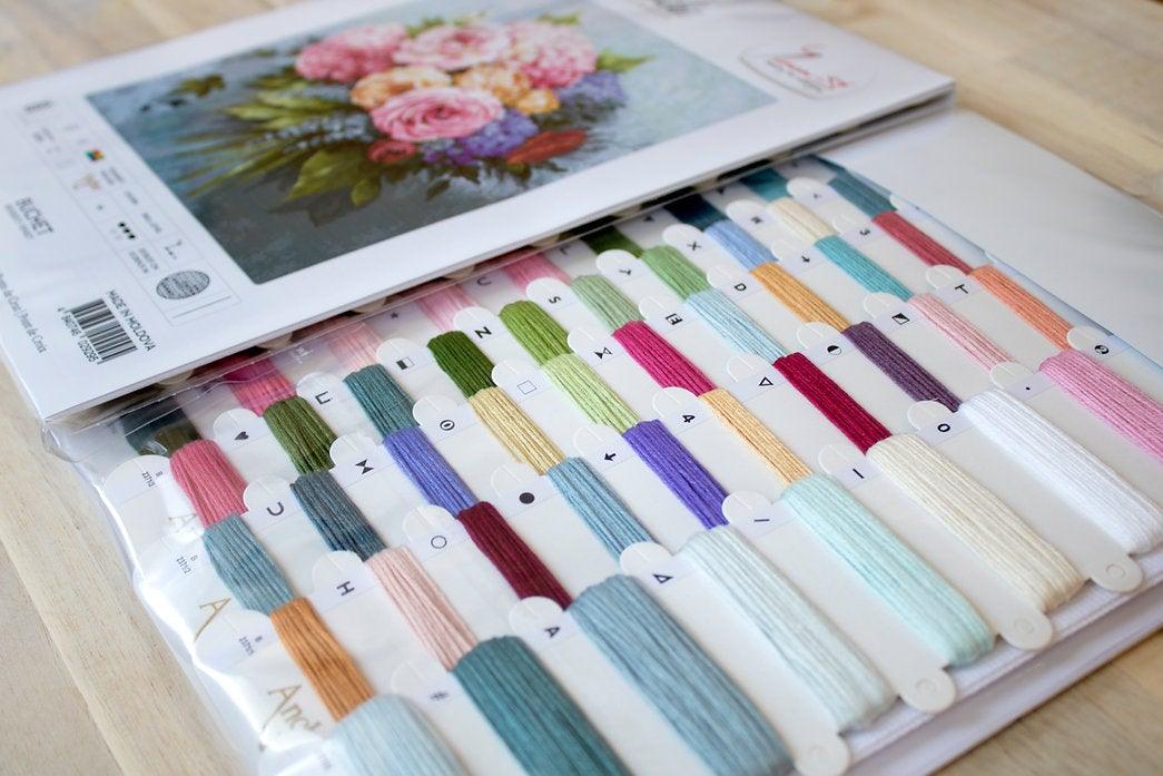 Bouquet B2371L Counted Cross-Stitch Kit featuring pink roses, yellow peonies, and blue pansies on Aida canvas.