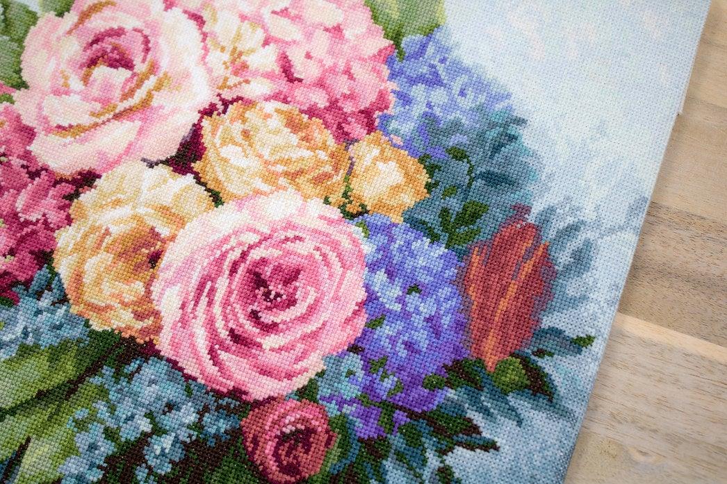 Bouquet B2371L Counted Cross-Stitch Kit featuring pink roses, yellow peonies, and blue pansies on Aida canvas.