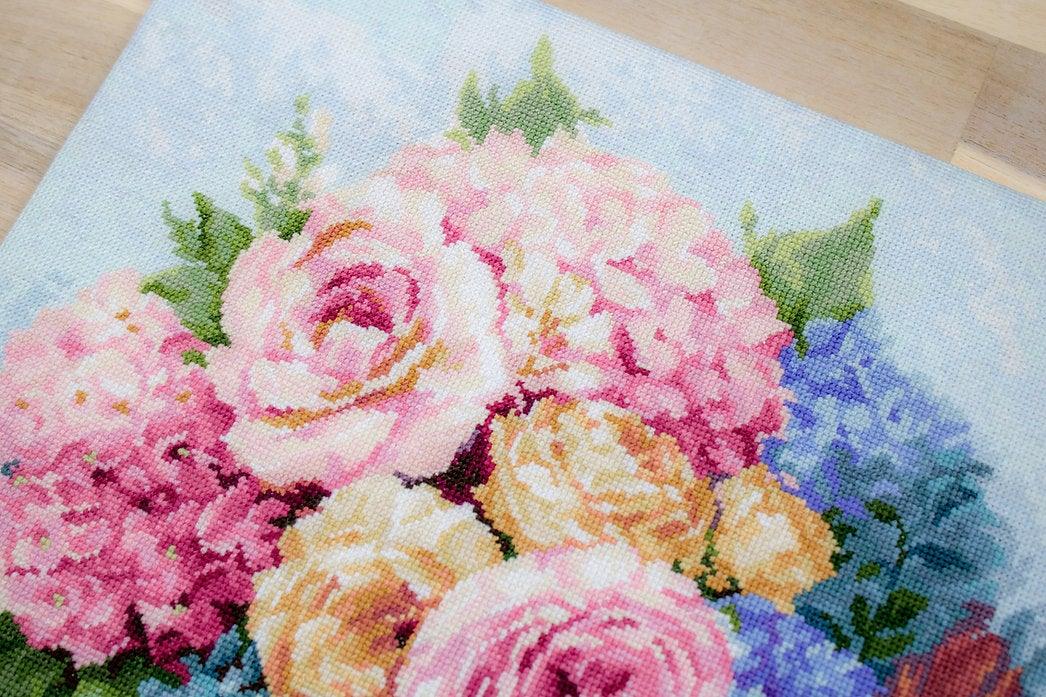 Bouquet B2371L Counted Cross-Stitch Kit featuring pink roses, yellow peonies, and blue pansies on Aida canvas.