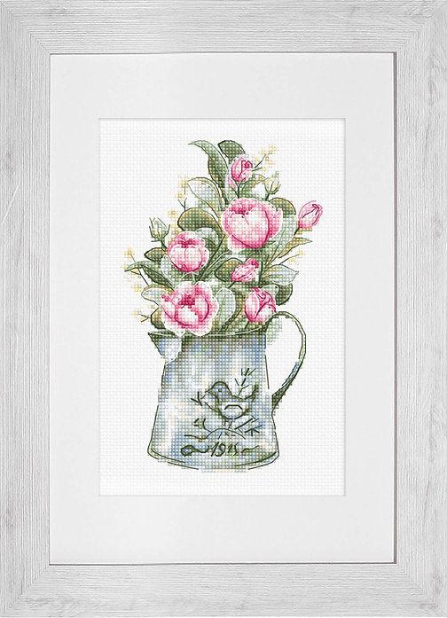 A counted cross-stitch kit featuring a bouquet of roses in a watering can, showcasing vibrant colors and high-quality materials.