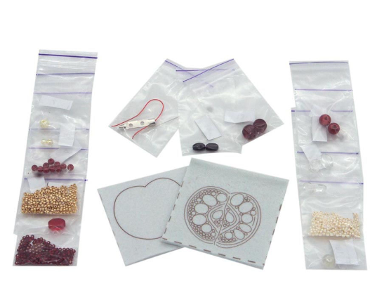 BP-188C Beadwork kit featuring a red apple design with various beads and crafting materials.