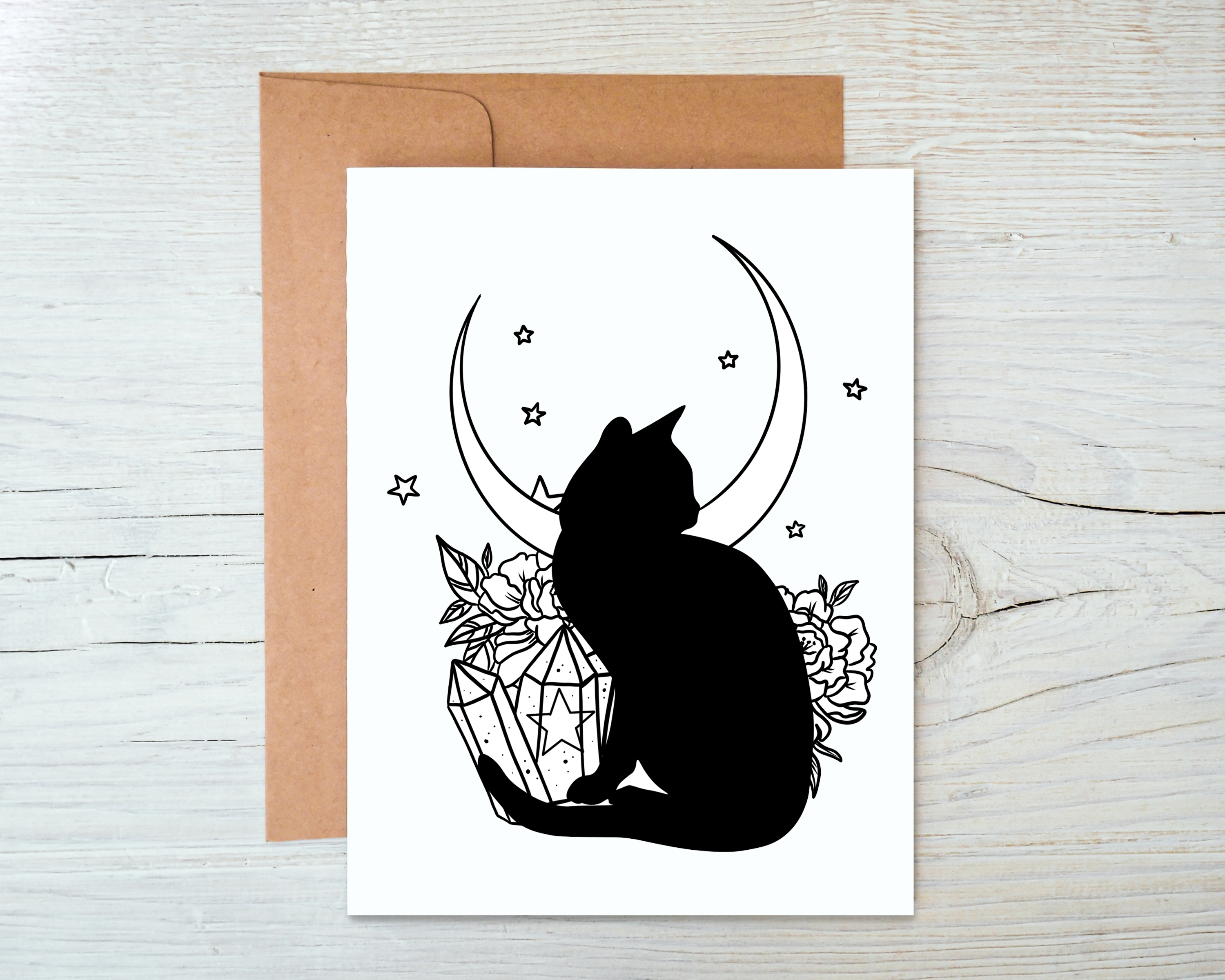 A whimsical Cat and Crystal Card featuring a cat design, blank inside, accompanied by a kraft envelope, perfect for heartfelt messages.