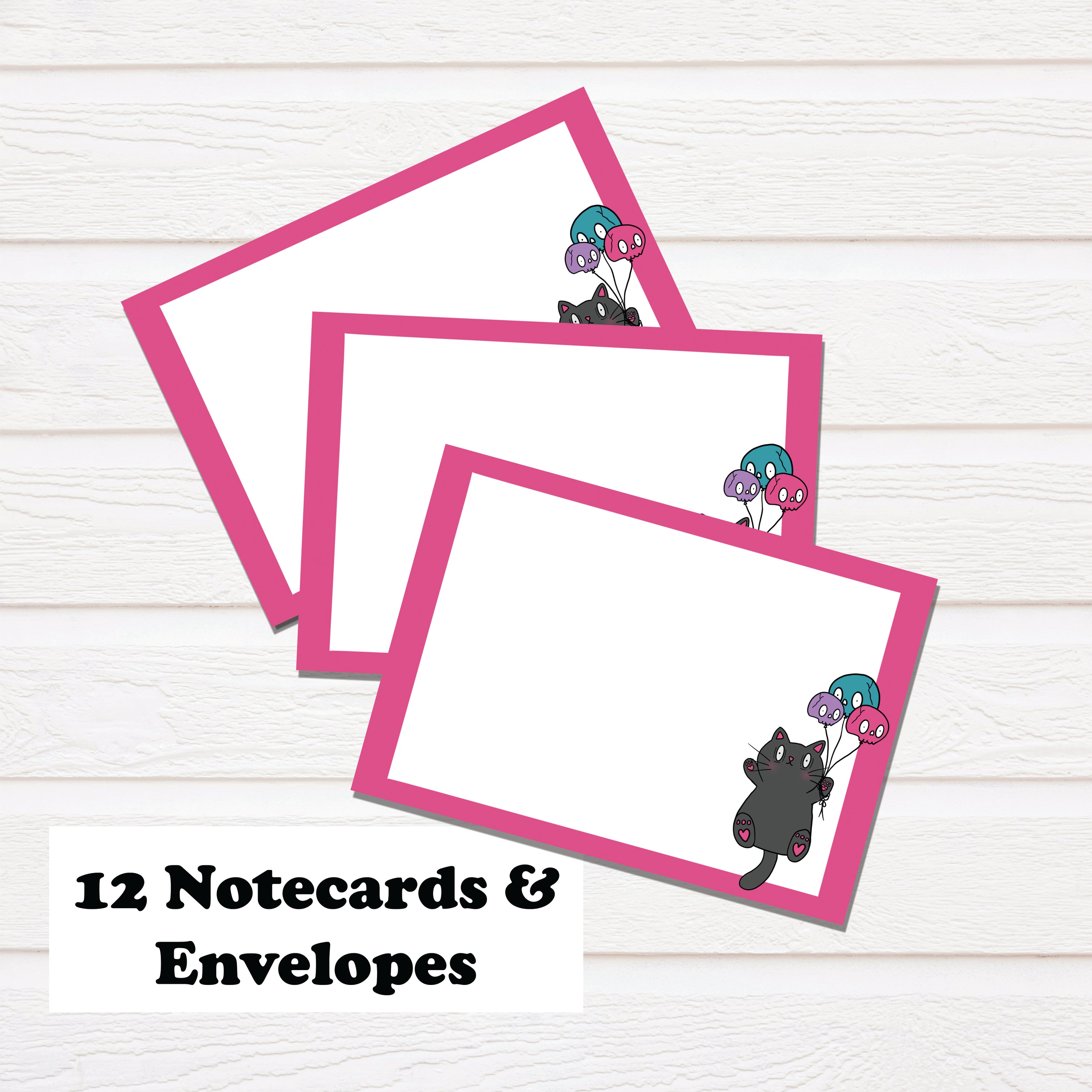 Cat and Skull Balloon Notecard Stationary Set featuring hand-drawn illustrations, 12 notecards, and matching envelopes in a clear box.