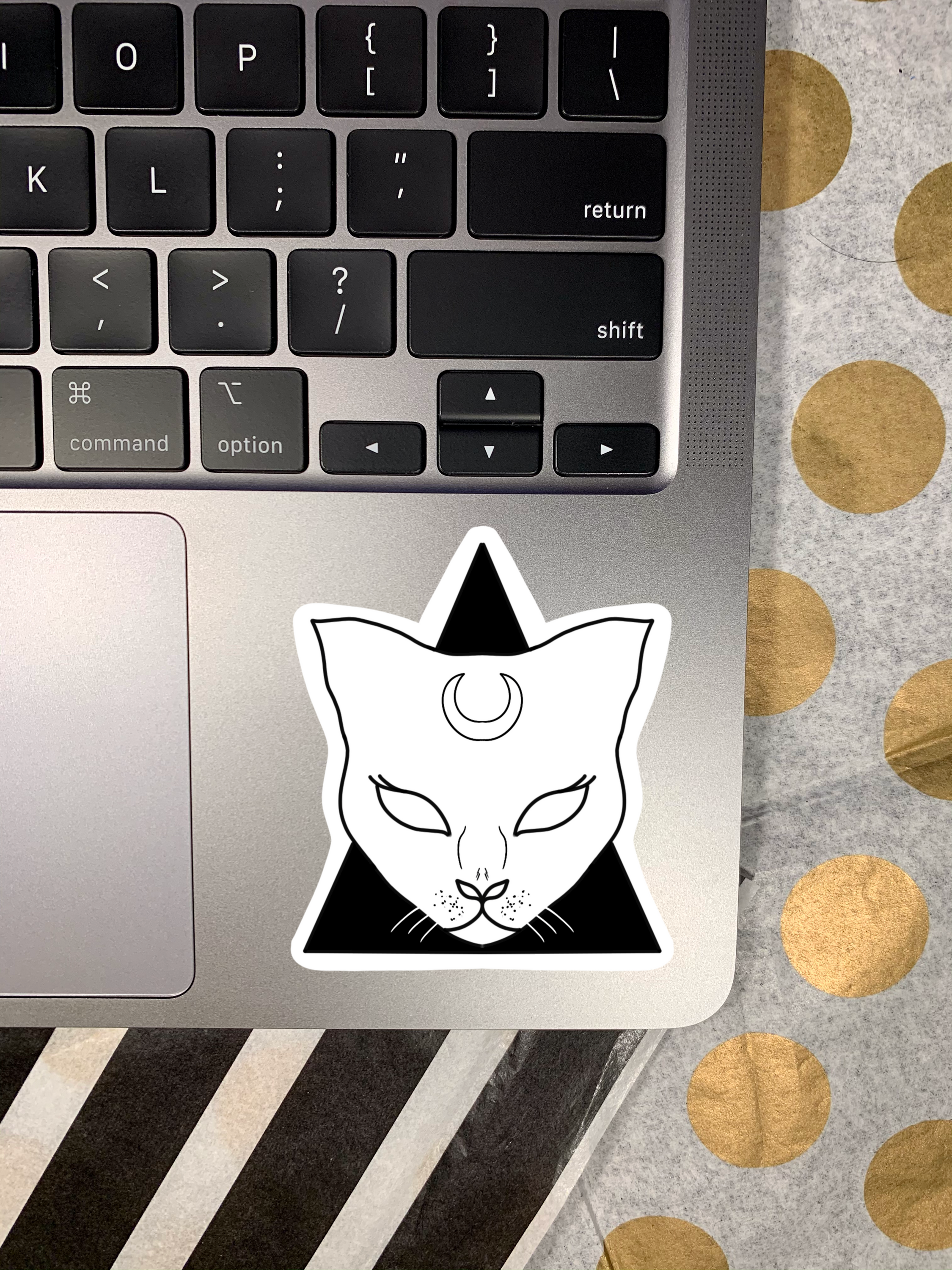 A vibrant cat sticker featuring a playful design, perfect for personalizing items like laptops and water bottles.