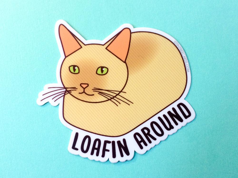 A cute vinyl sticker featuring a cat in a loaf position with the text 'Loafin Around'. Perfect for personalizing items.