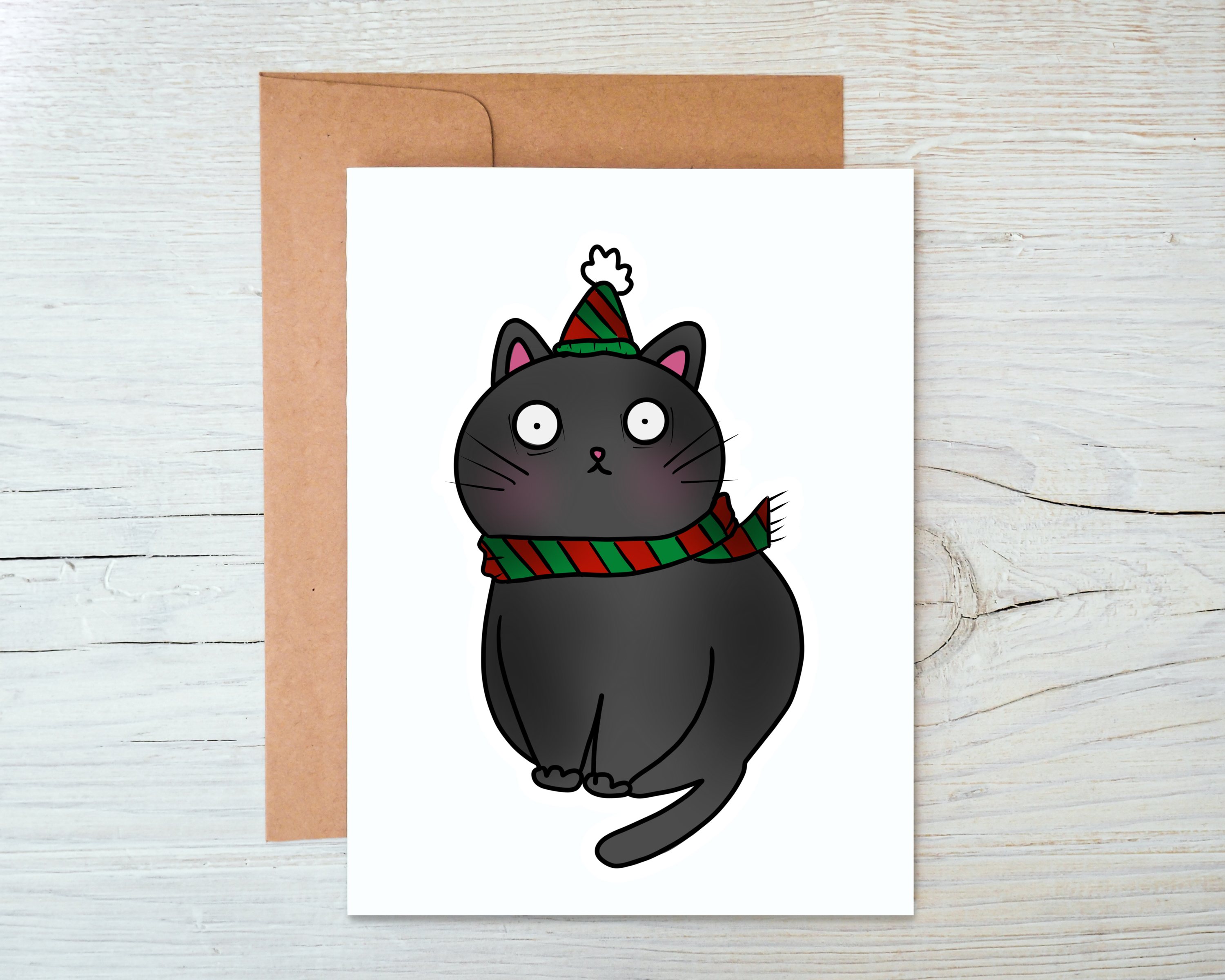 A festive Christmas Cat Card featuring a whimsical cat design, blank inside, accompanied by a kraft envelope.