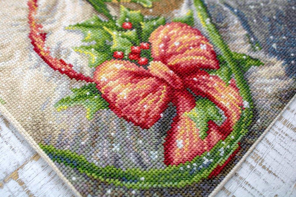 Christmas Deer B598L Counted Cross-Stitch Kit featuring Aida canvas, colorful threads, and a needle for festive crafting.