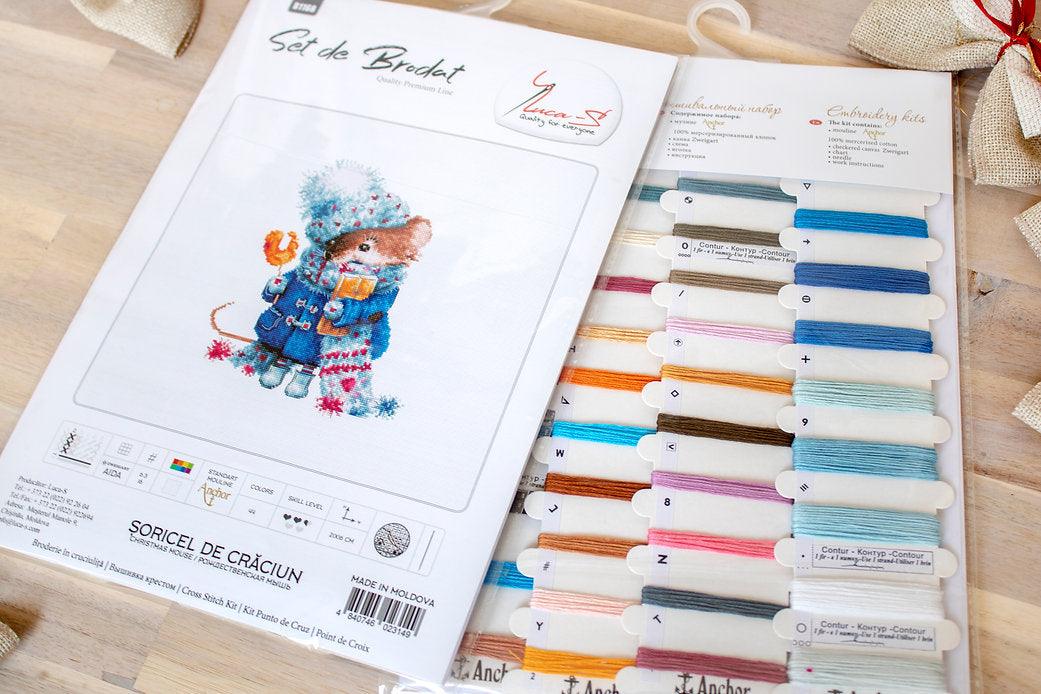 Christmas mouse counted cross-stitch kit with colorful threads and canvas.