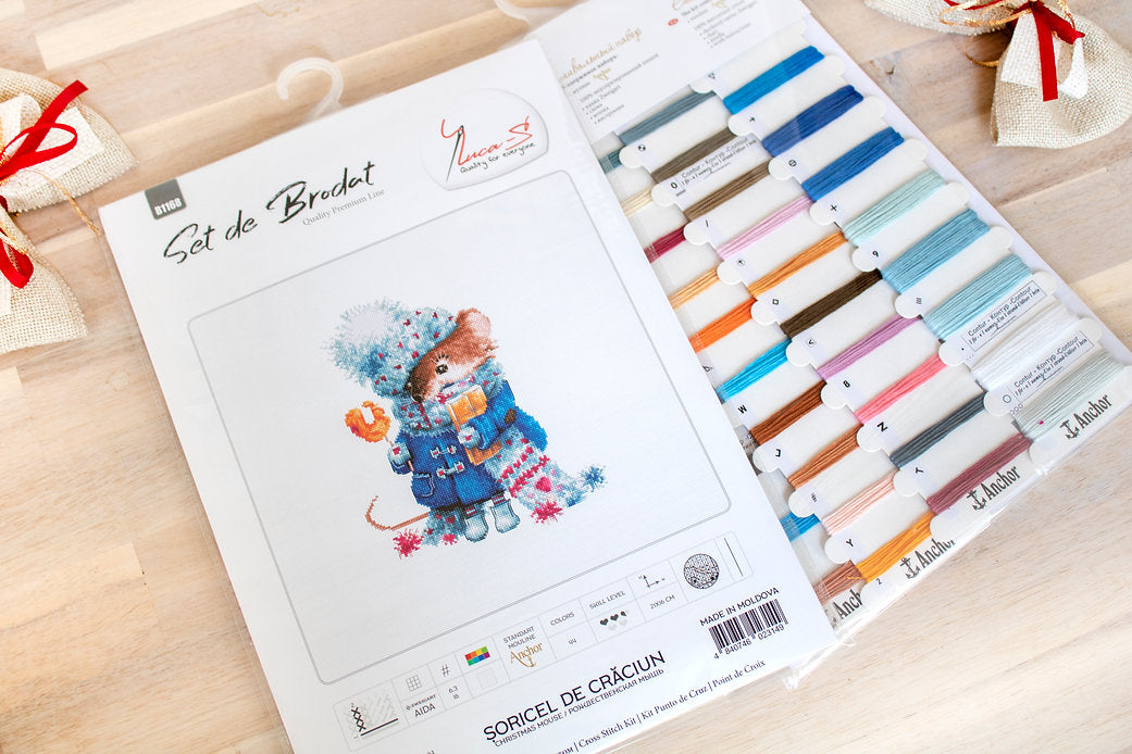 Christmas mouse counted cross-stitch kit with colorful threads and canvas.