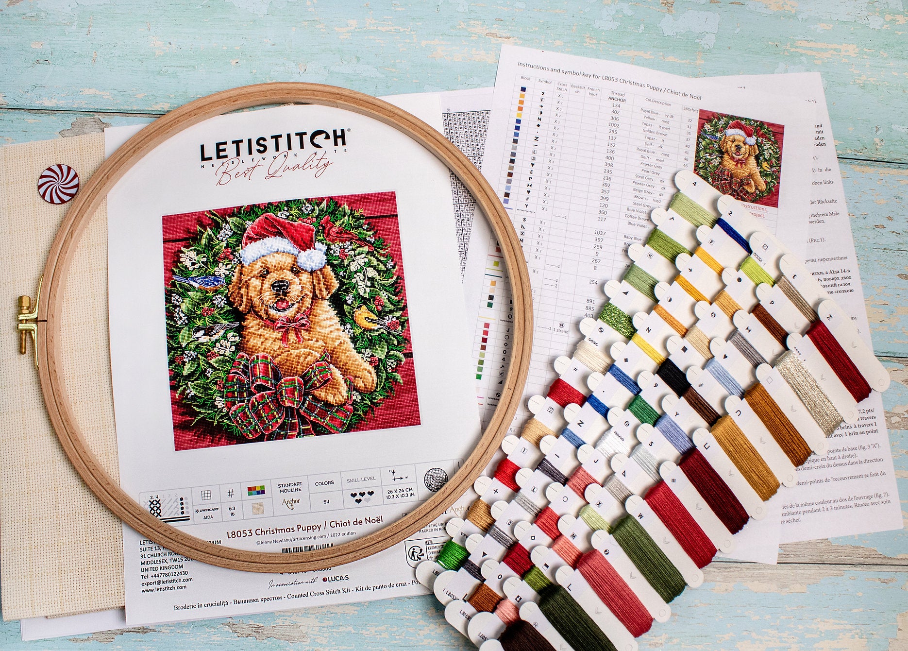Christmas Puppy Counted Cross Stitch Kit featuring a festive design with 54 colors, needle, and instructions on 16-count Aida canvas.