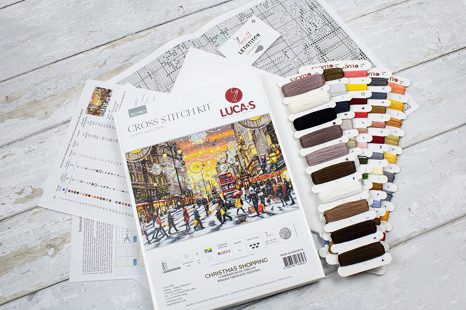 Christmas Shopping BU5007L Counted Cross-Stitch Kit with Aida canvas, colorful threads, and needle for holiday crafting.