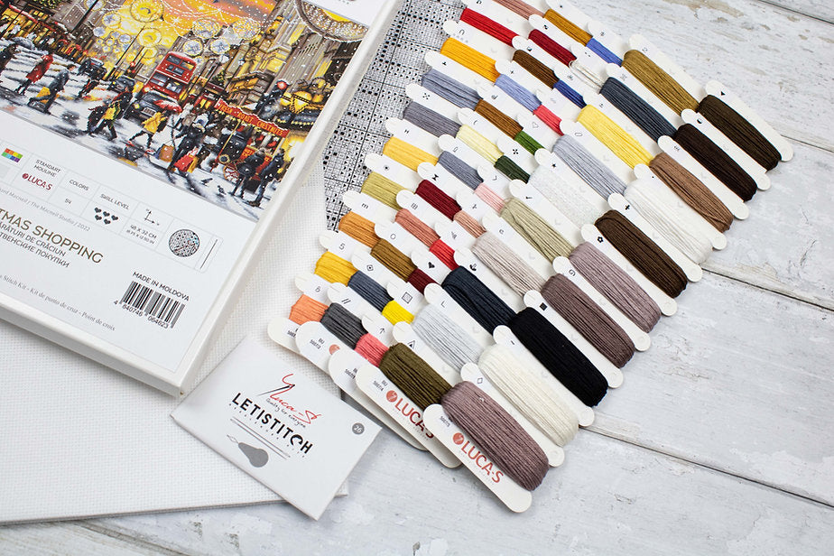 Christmas Shopping BU5007L Counted Cross-Stitch Kit with Aida canvas, colorful threads, and needle for holiday crafting.