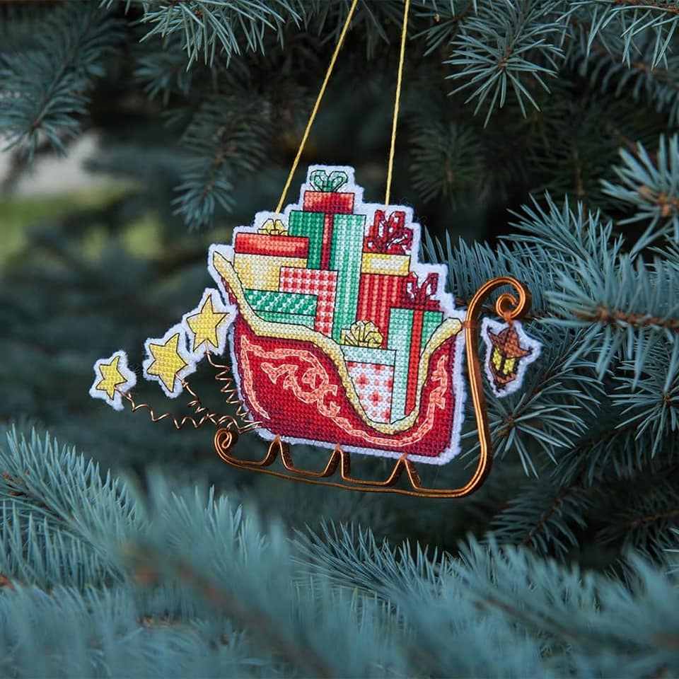 Colorful Christmas tree toy cross-stitch kit with plastic canvas and Madeira cotton floss.