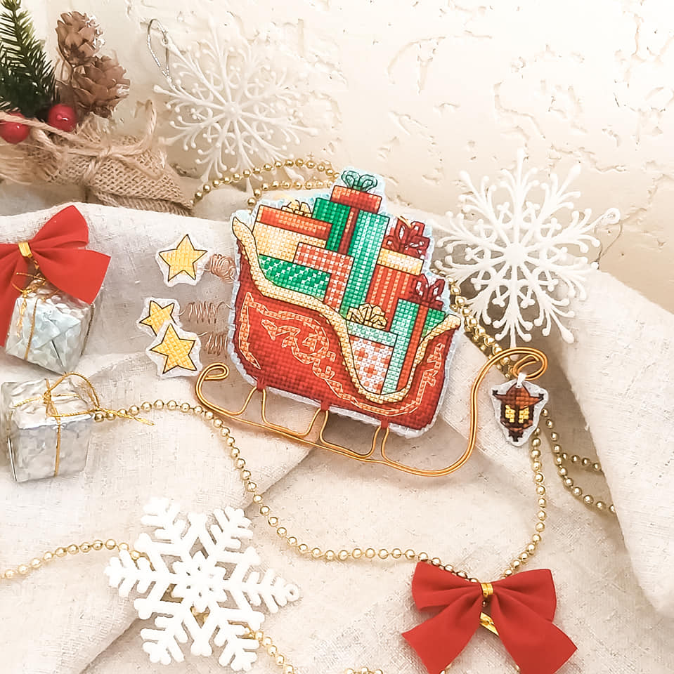 Colorful Christmas tree toy cross-stitch kit with plastic canvas and Madeira cotton floss.