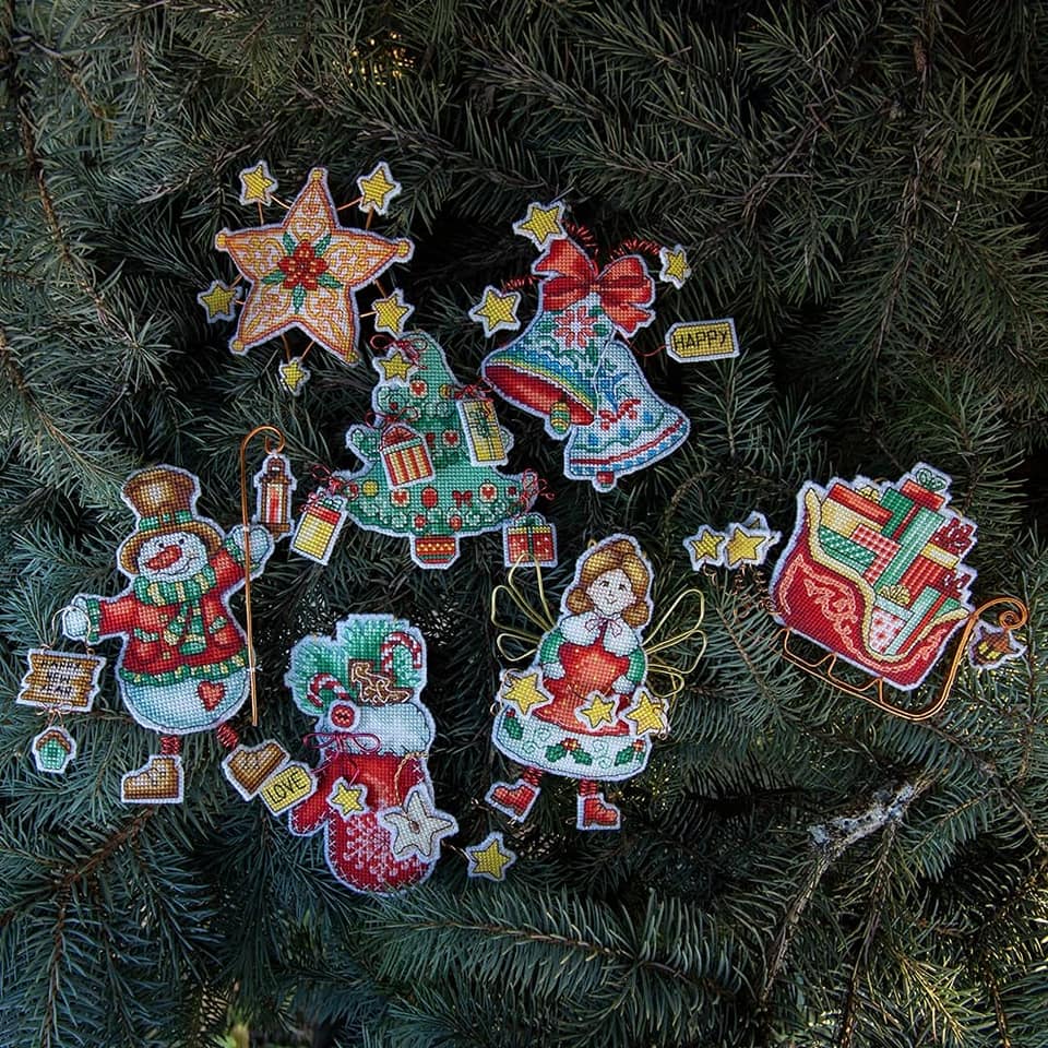 Christmas tree toy cross-stitch kit featuring colorful Madeira cotton floss and plastic canvas materials.