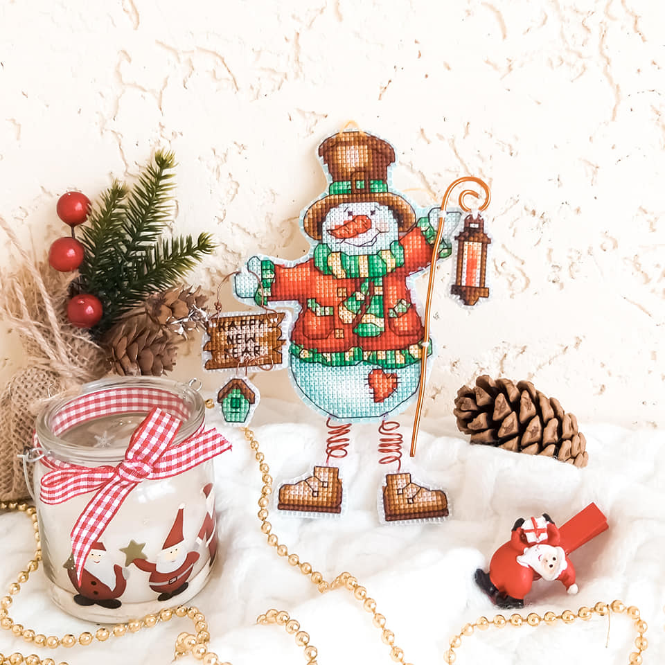 Colorful Christmas tree toy cross-stitch kit with plastic canvas and Madeira cotton floss.
