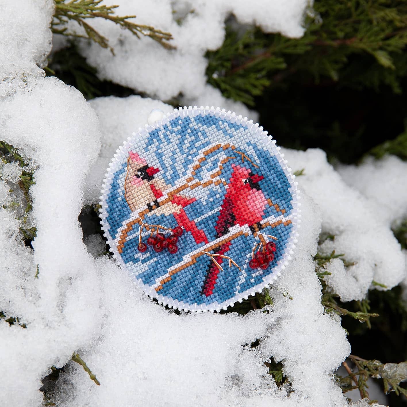 Christmas tree toy cross-stitch kit featuring plastic canvas, colorful Madeira cotton floss, and Czech beads, perfect for holiday crafting.