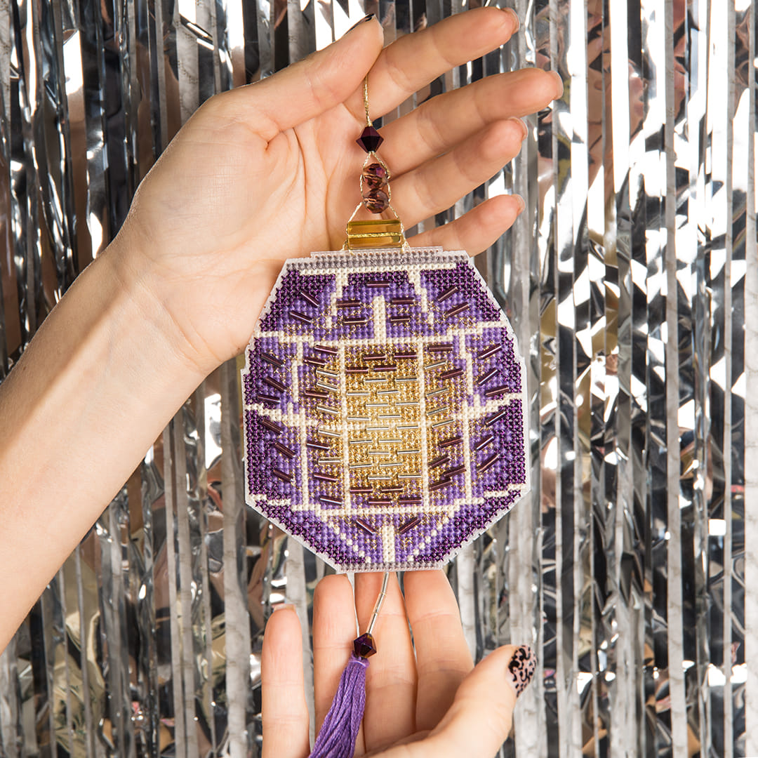 Colorful Christmas tree toy cross-stitch kit with plastic canvas and beads, featuring vibrant colors and detailed instructions.