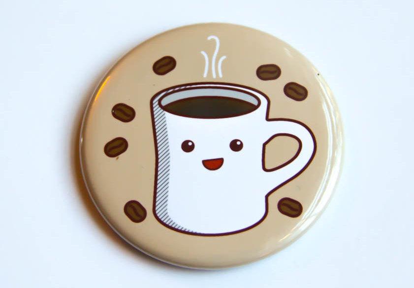 A 2.25-inch round coffee-themed magnet, pinback button, or pocket mirror featuring a cheerful coffee design.