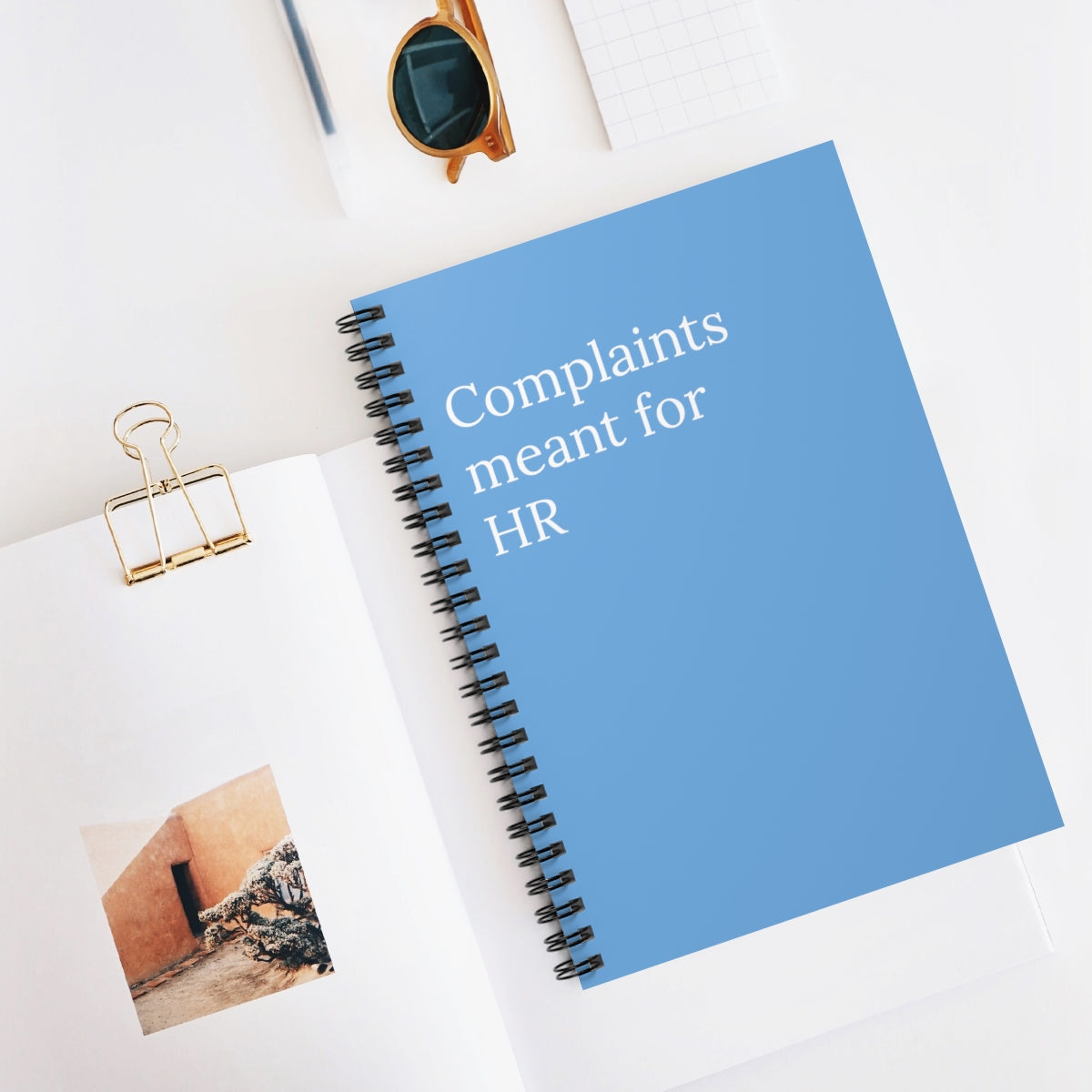 A humorous spiral notebook titled 'Complaints meant for HR' featuring ruled line pages, perfect for office use.