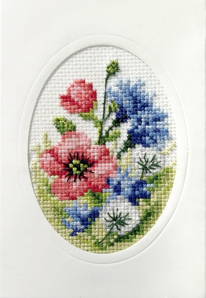 Complete cross stitch kit featuring 'Wild Flowers' design, including Zweigart aida fabric, DMC threads, blank card, envelope, and needle.