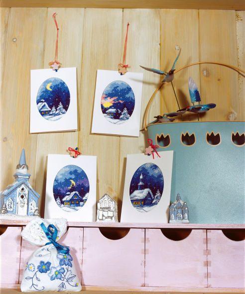 Complete cross stitch kit featuring a winter night design, including Zweigart aida fabric, DMC threads, blank card, and envelope.