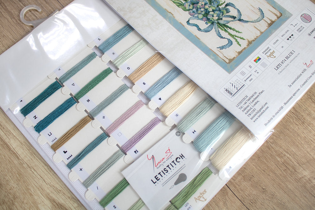 Counted Cross Stitch Kit BLUE I Leti974 featuring vibrant Anchor threads, canvas, needle, and instructions for crafting.