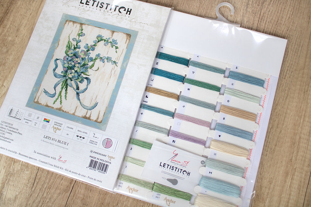 Counted Cross Stitch Kit BLUE I Leti974 featuring vibrant Anchor threads, canvas, needle, and instructions for crafting.