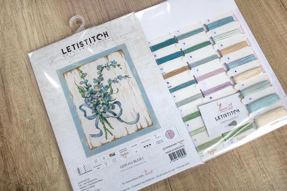 Counted Cross Stitch Kit BLUE I Leti974 featuring vibrant Anchor threads, canvas, needle, and instructions for crafting.