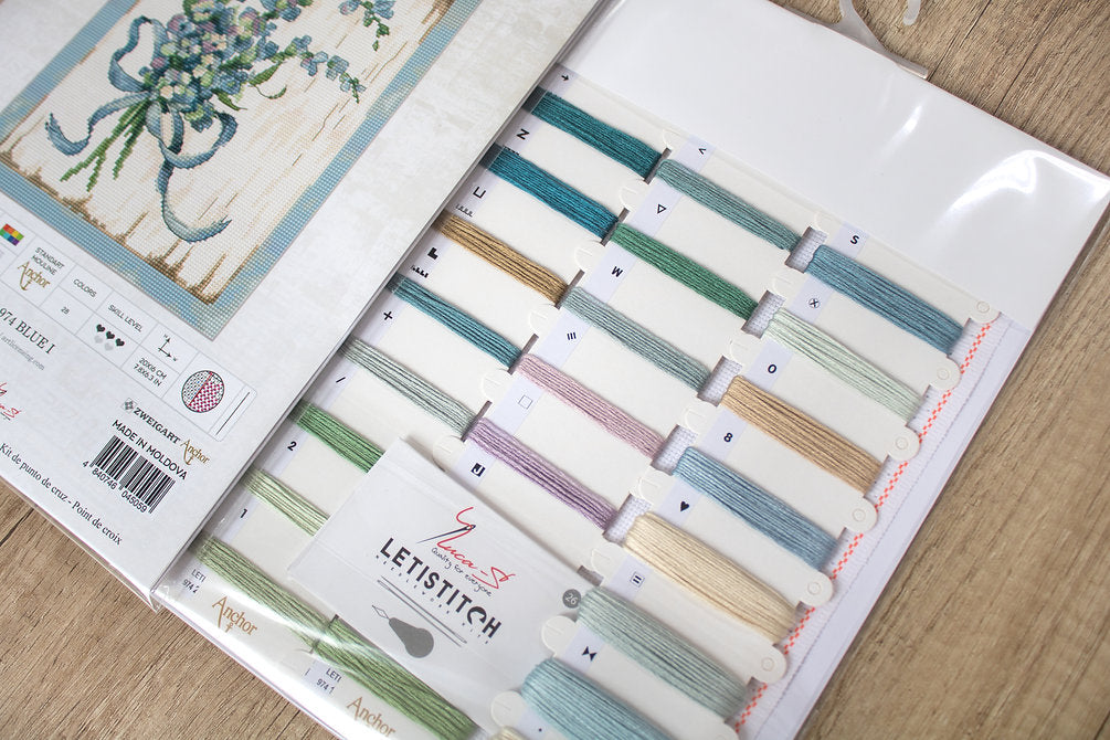 Counted Cross Stitch Kit BLUE I Leti974 featuring vibrant Anchor threads, canvas, needle, and instructions for crafting.