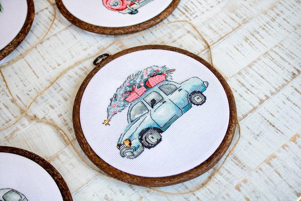 Counted Cross Stitch Kit featuring Christmas Retro Cars with colorful threads and canvas, perfect for holiday crafting.