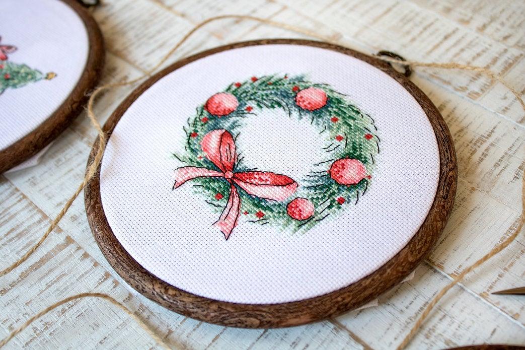 Counted Cross Stitch Kit featuring Christmas Retro Cars with colorful threads and canvas, perfect for holiday crafting.