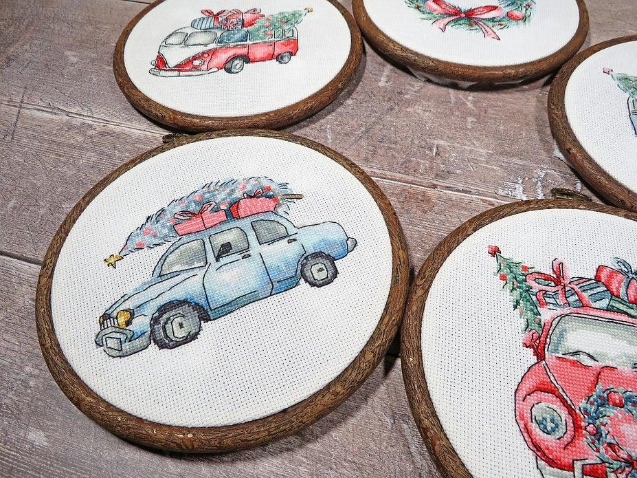 Counted Cross Stitch Kit featuring Christmas Retro Cars with colorful threads and canvas, perfect for holiday crafting.