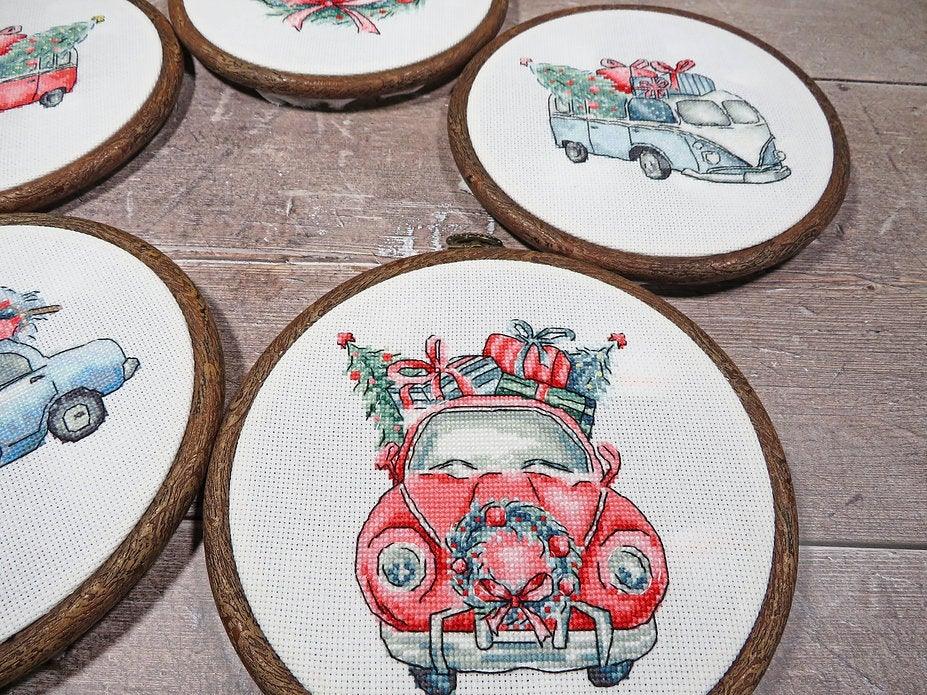 Counted Cross Stitch Kit featuring Christmas Retro Cars with colorful threads and canvas, perfect for holiday crafting.