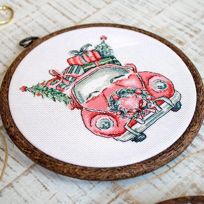 Counted Cross Stitch Kit featuring Christmas Retro Cars with colorful threads and canvas, perfect for holiday crafting.