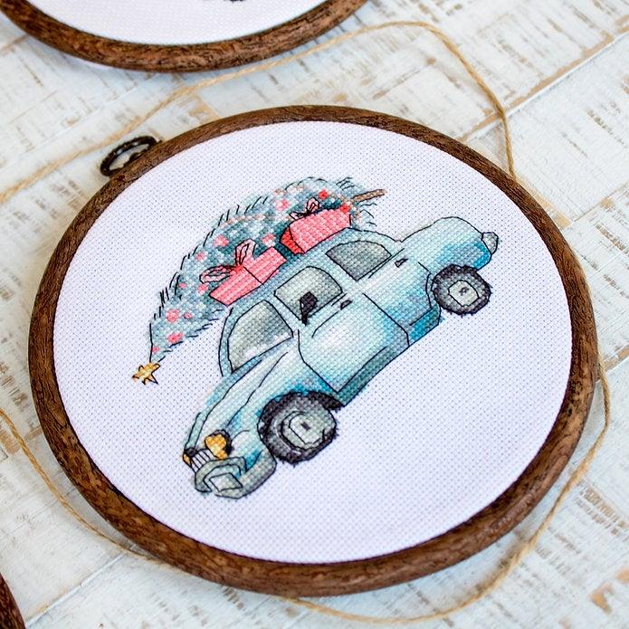 Counted Cross Stitch Kit featuring Christmas Retro Cars with colorful threads and canvas, perfect for holiday crafting.
