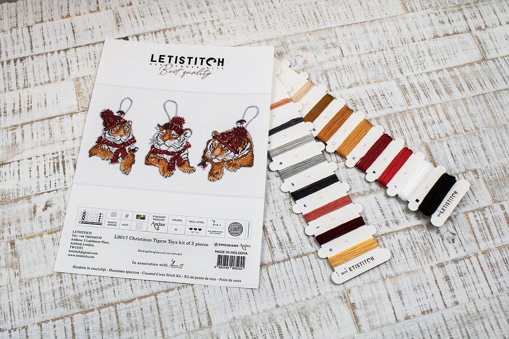 Counted Cross Stitch Kit featuring three Christmas Tiger designs with colorful threads and Aida canvas.