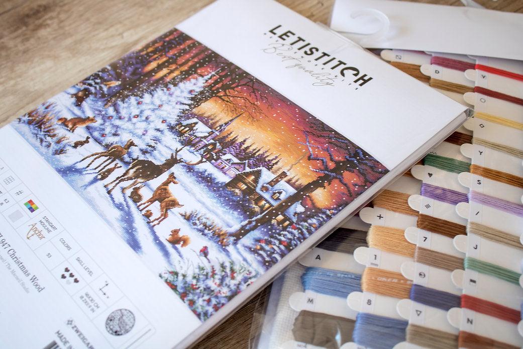 Counted Cross Stitch Kit Christmas Wood Leti947 featuring colorful threads and Aida canvas for festive stitching.