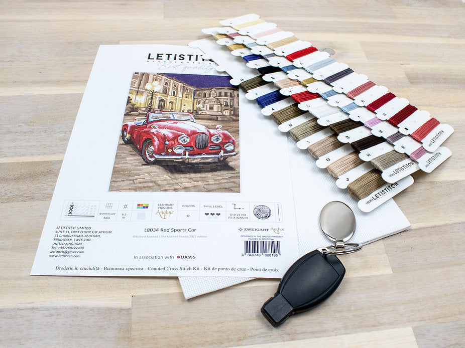 Counted Cross Stitch Kit featuring a vibrant red sports car design with included materials like canvas, threads, and needle.