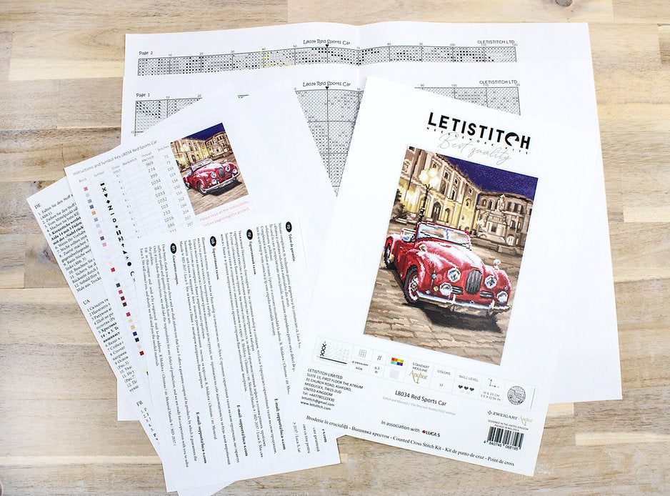 Counted Cross Stitch Kit featuring a vibrant red sports car design with included materials like canvas, threads, and needle.