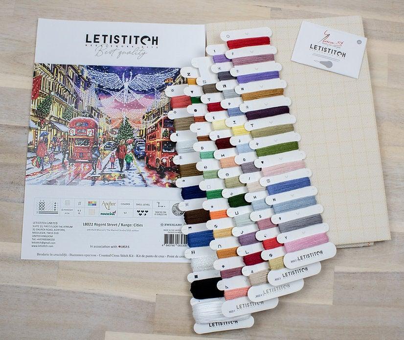 Counted Cross Stitch Kit Regent Street with Aida canvas, colorful threads, and instructions for stitching.