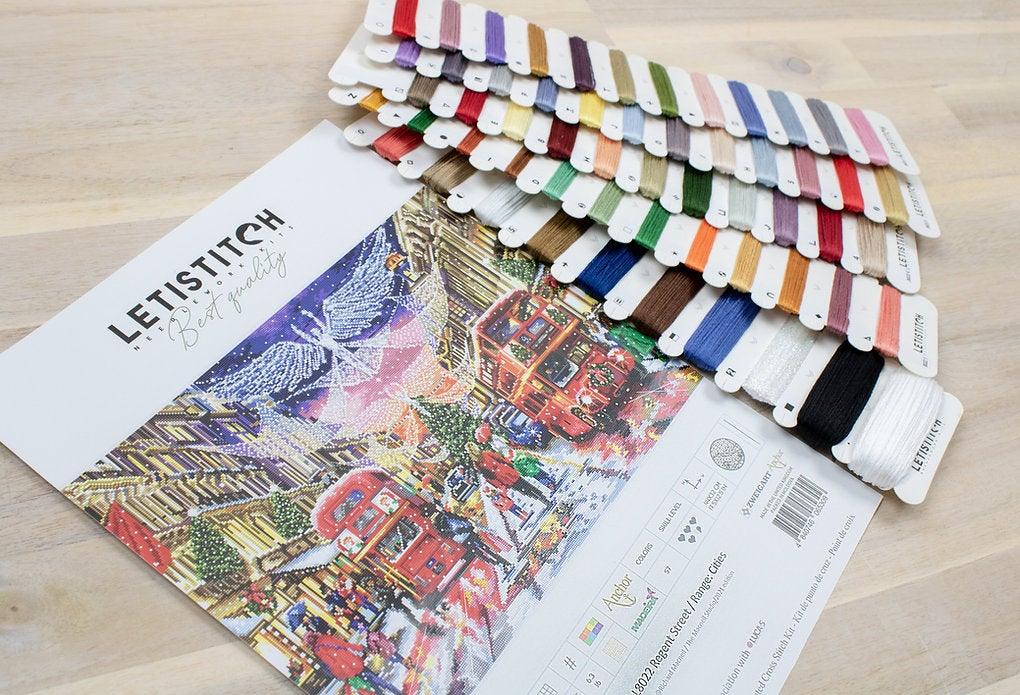 Counted Cross Stitch Kit Regent Street with Aida canvas, colorful threads, and instructions for stitching.