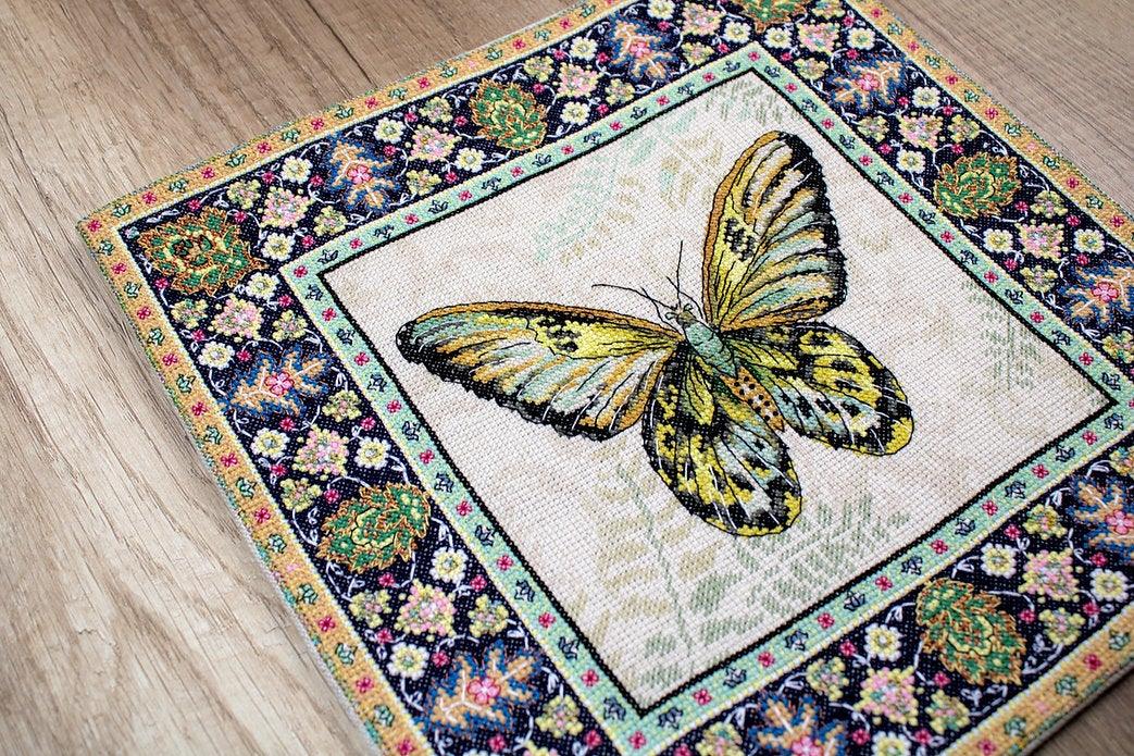 Counted Cross Stitch Kit Vintage Butterfly Leti981 with canvas, threads, and needle, showcasing vibrant colors and butterfly design.