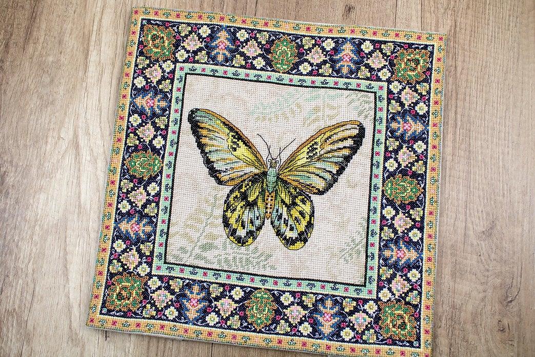 Counted Cross Stitch Kit Vintage Butterfly Leti981 with canvas, threads, and needle, showcasing vibrant colors and butterfly design.
