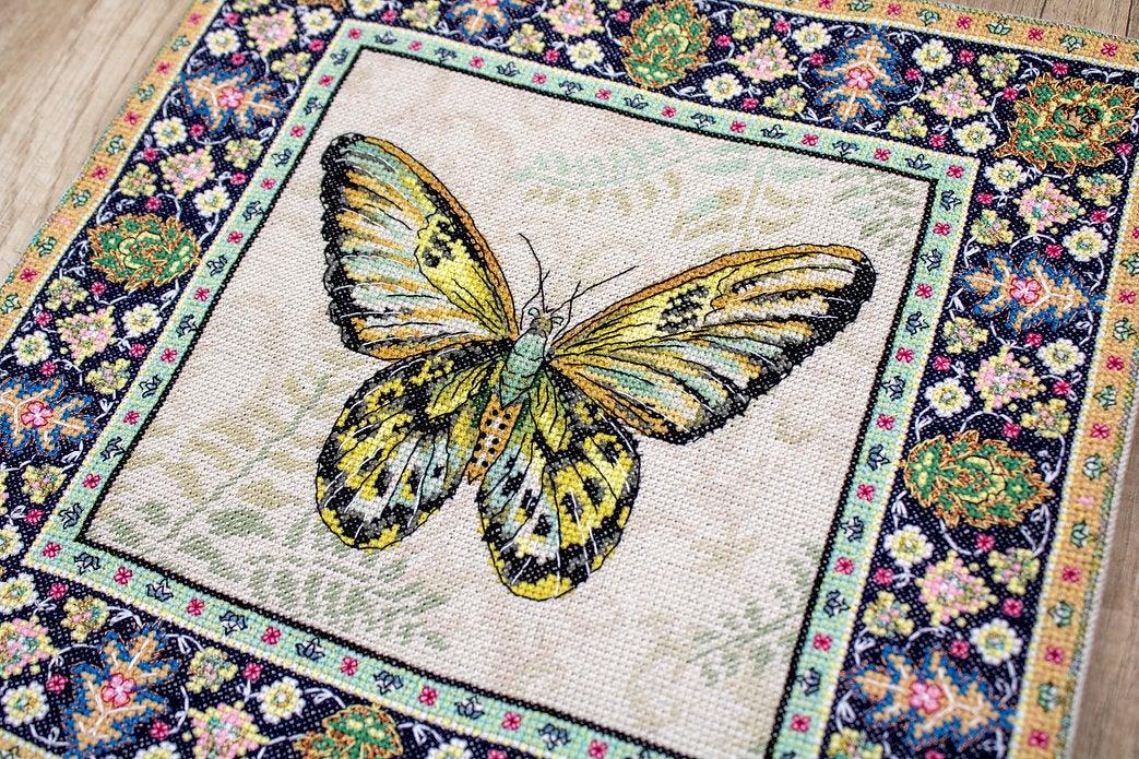 Counted Cross Stitch Kit Vintage Butterfly Leti981 with canvas, threads, and needle, showcasing vibrant colors and butterfly design.