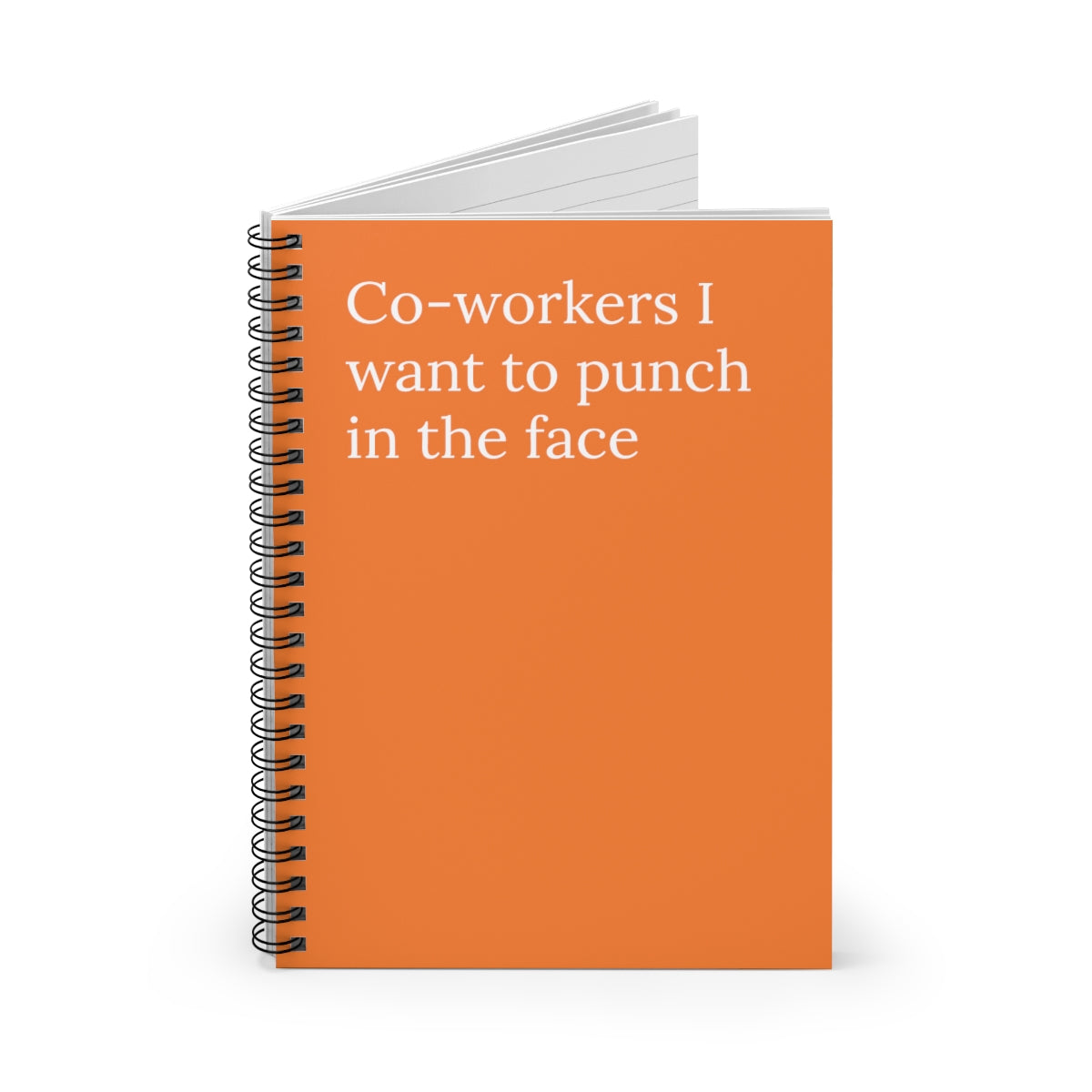 A spiral notebook with a humorous cover reading 'Co-Workers I Want to Punch in the Face', featuring ruled line pages inside.