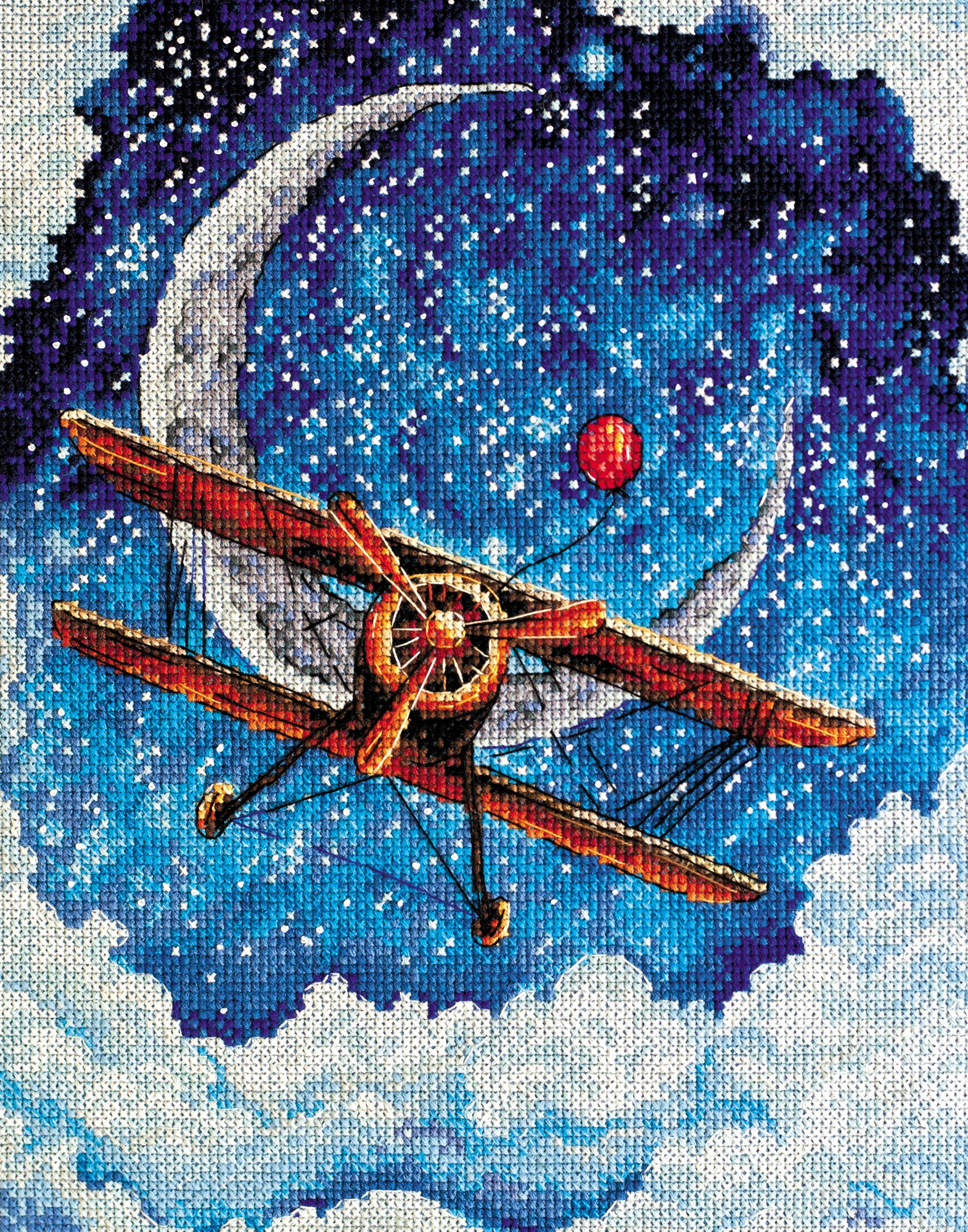 Cross-stitch kit Above the Clouds AH-093 featuring dark blue canvas, colorful floss, and stitching supplies.